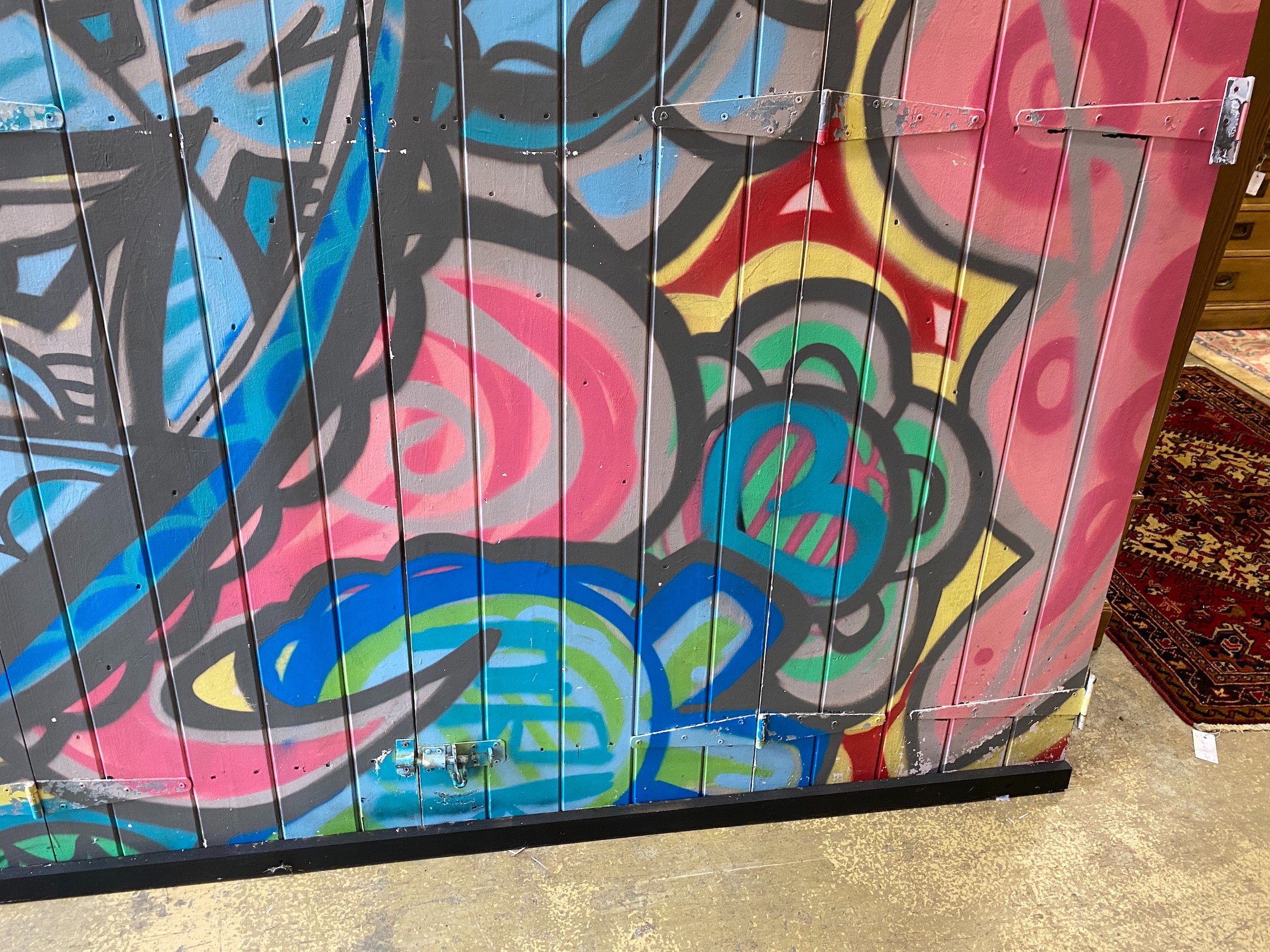 A wooden door from Camden Market with painted graffiti art width 216cm, height 207cm